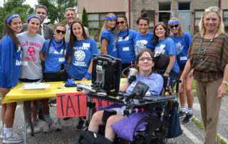 Monmouth County Freeholders Pat Impreveduto and Gerry Scharfenberger (back row, left) join Holmdel High School athletes, LADACIN Executive Director, Patricia Carlesimo, and Denise, a former client and employee at LADACIN Network’s Schroth School carnival.